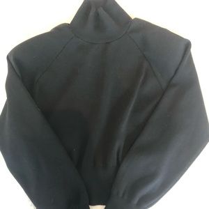 Cropped turtle neck with shoulder pads